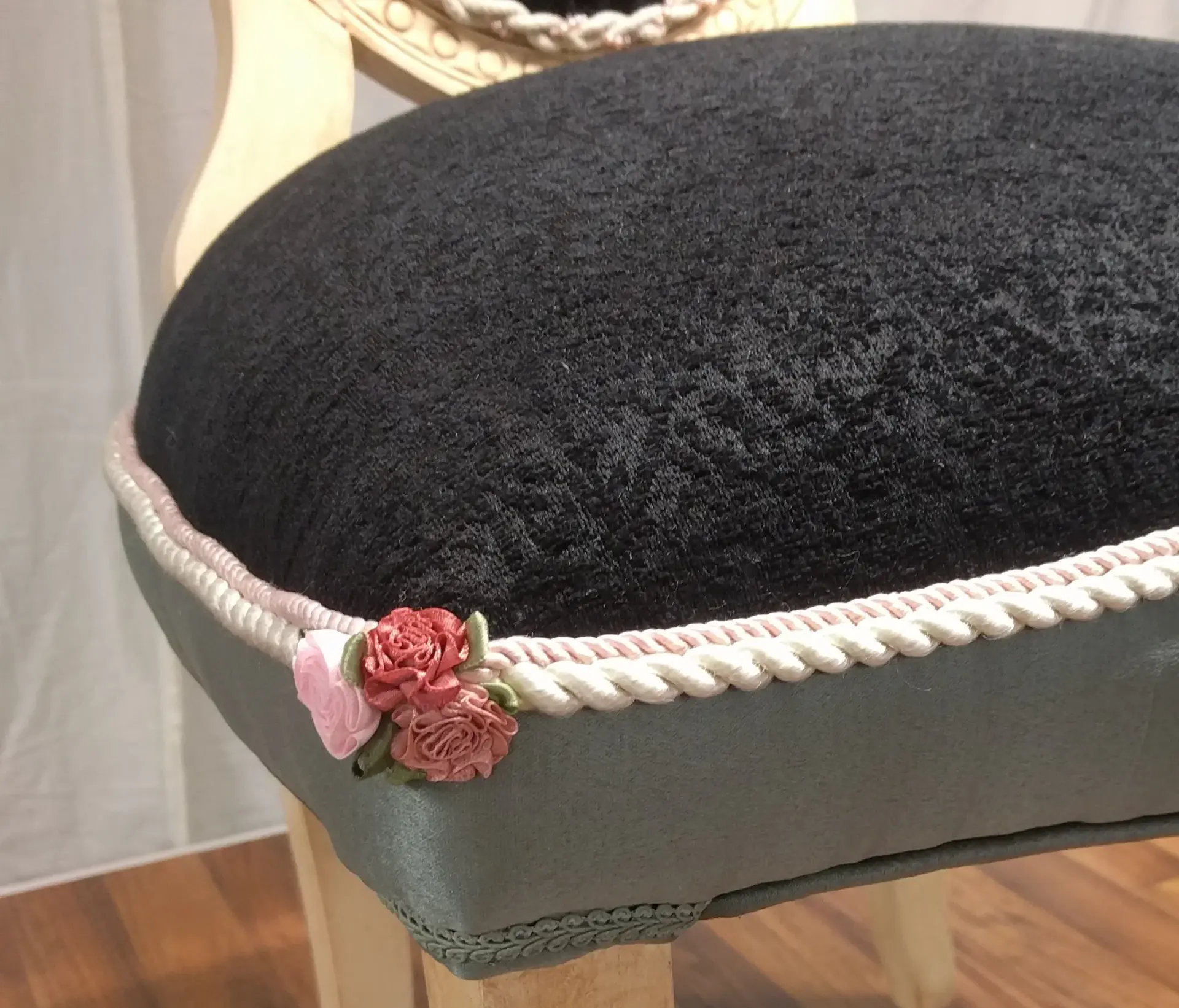 Decorative upholstery trim and detailed finishing on an upholstered chair