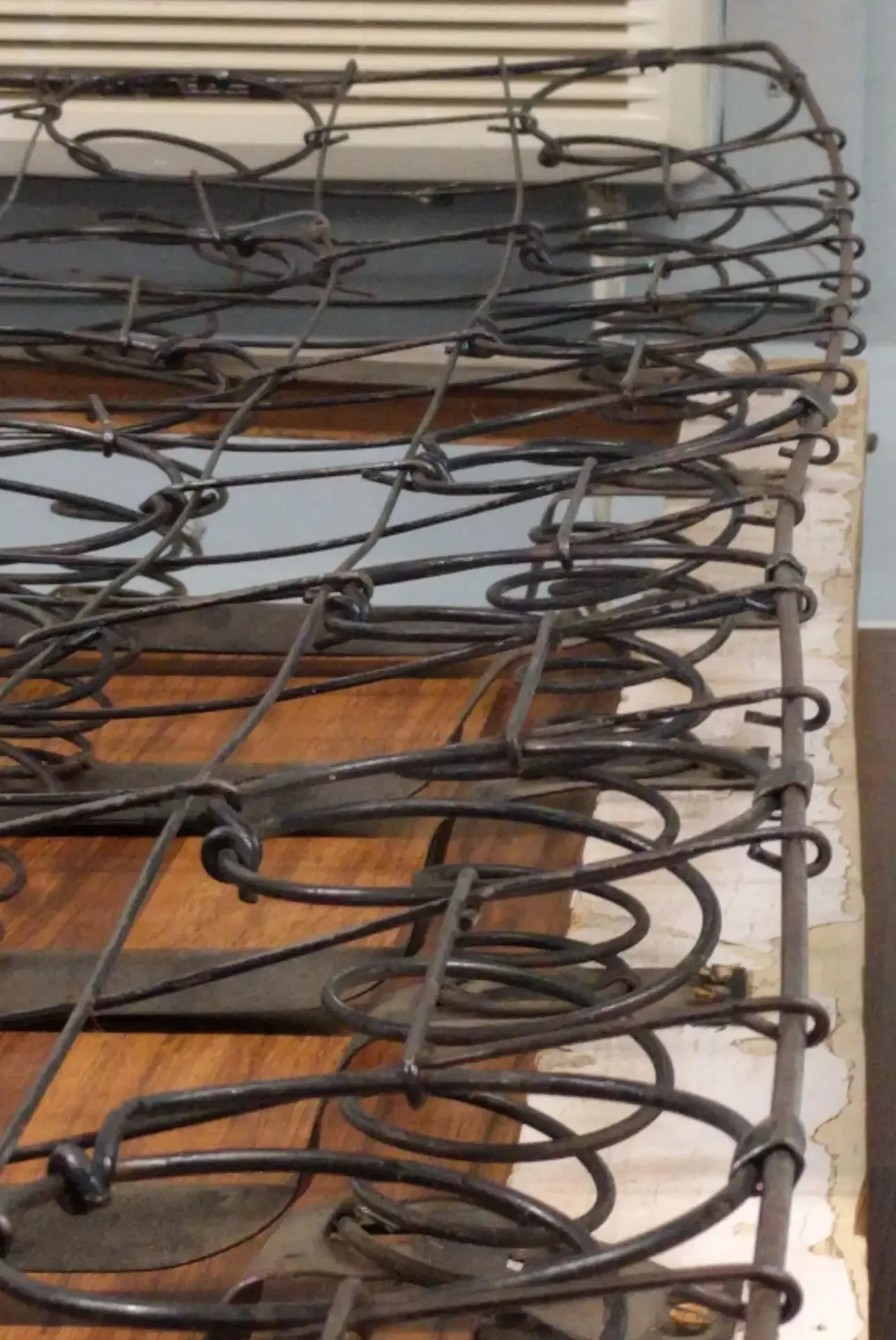Exposed coil springs and support components during upholstery rebuilding.