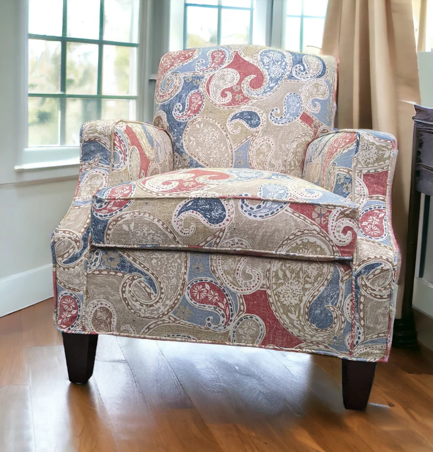 Armchair upholstered in a large multicolor patterned fabric