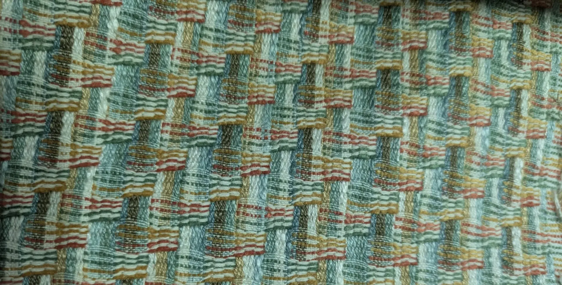 Close view of upholstery fabric and measuring tape