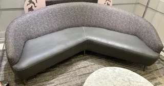 Curved upholstered sofa before reupholstery