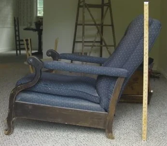 Wood-frame armchair before restoration with blue upholstery and worn exposed wood