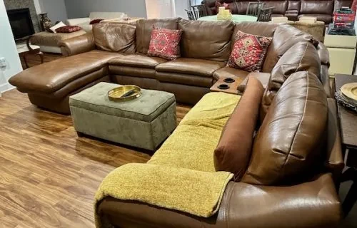 Large residential sectional with worn upholstery before renewal