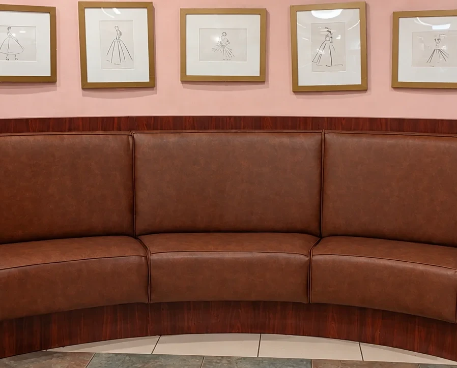 Curved upholstered restaurant banquette installed in a commercial dining environment